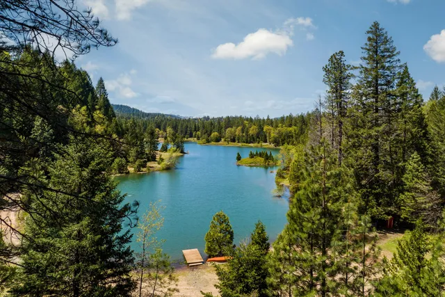 a view of a lake with a house in the background