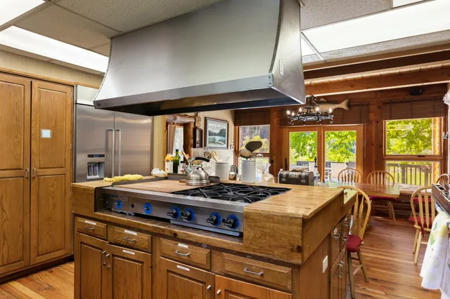 a kitchen with a stove and a refrigerator