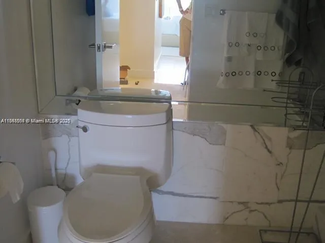 a bathroom with a toilet and a sink