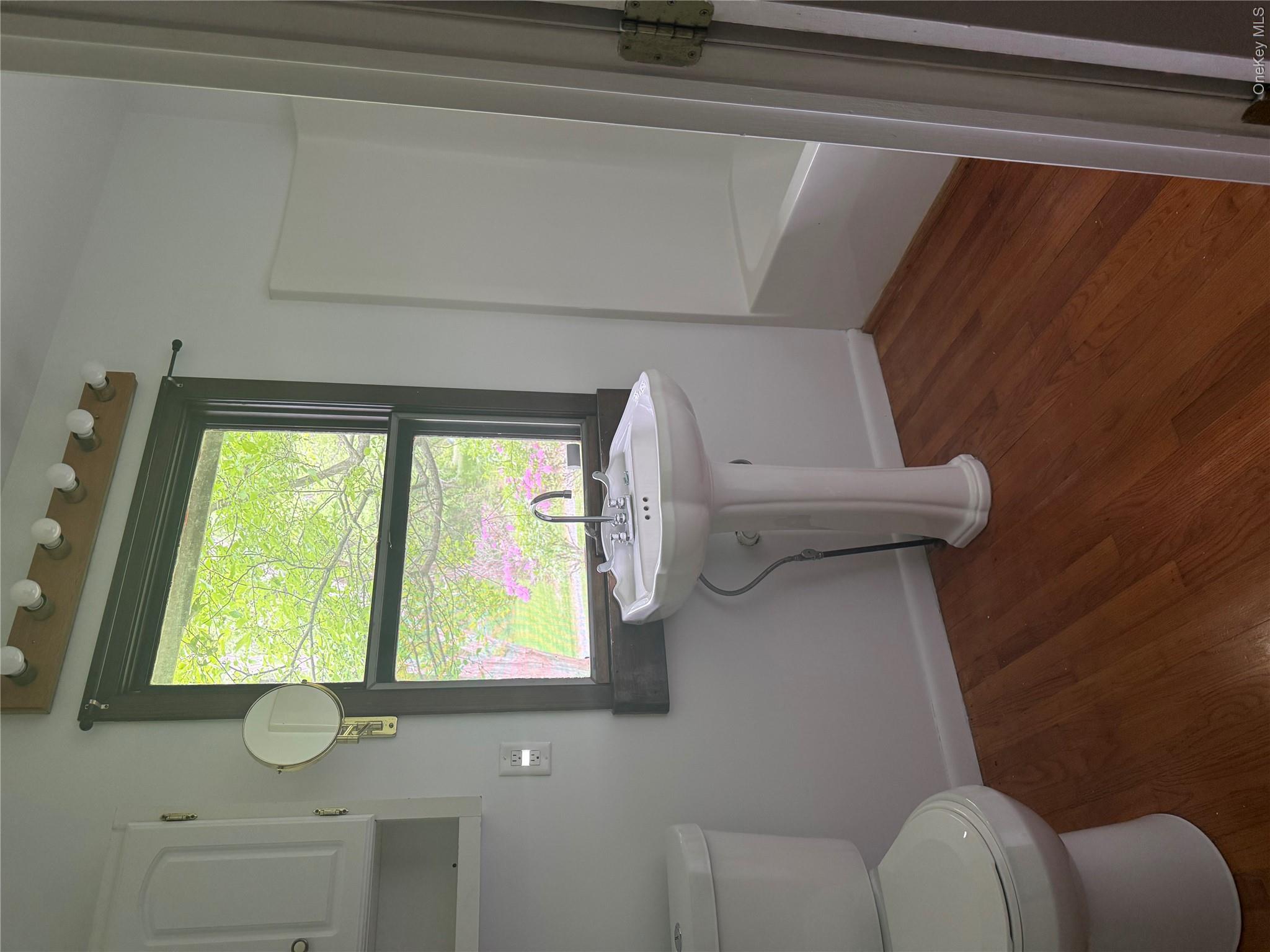 183 Barrytown Road Barrytown, NY 12507 - Photo 24 of 41 a bathroom with a toilet sink and window