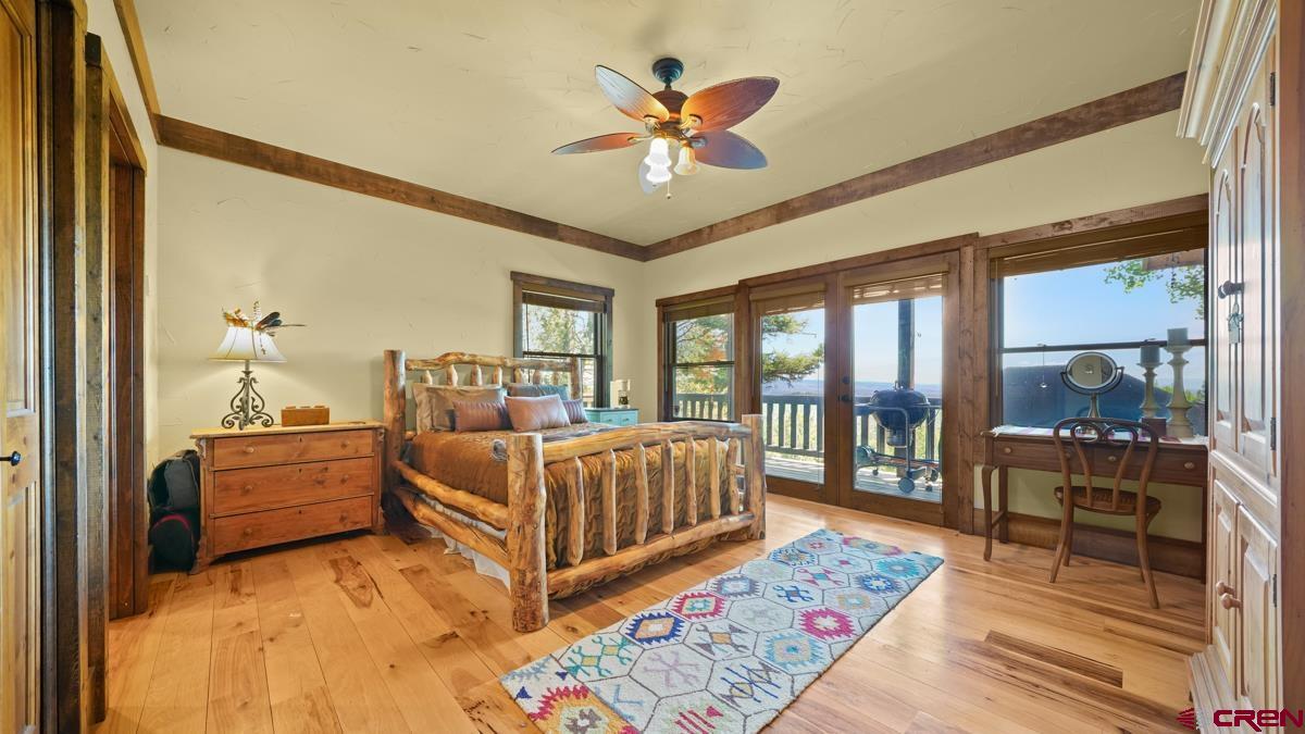 220 Ridge Road Cimarron, CO 81220 - Photo 14 of 45 a bed room with a bed and a large window