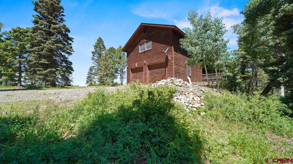 220 Ridge Road Cimarron, CO 81220 - Photo 40 of 45 a front view of a house with a yard