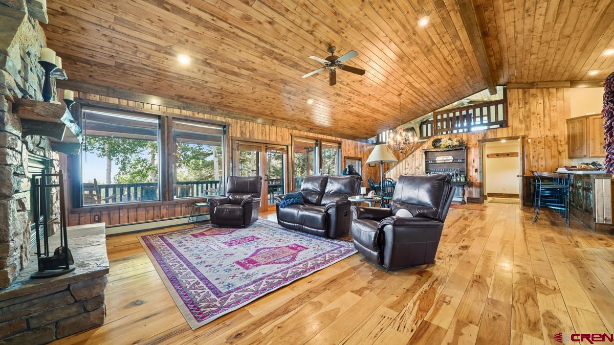 220 Ridge Road Cimarron, CO 81220 - Photo 7 of 45 a living room with furniture rug and wooden floor