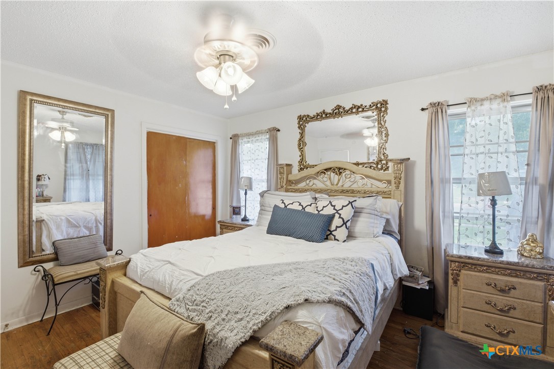 503 Cardinal Avenue Killeen, TX 76541 - Photo 20 of 26 a bedroom with a bed and wooden floor
