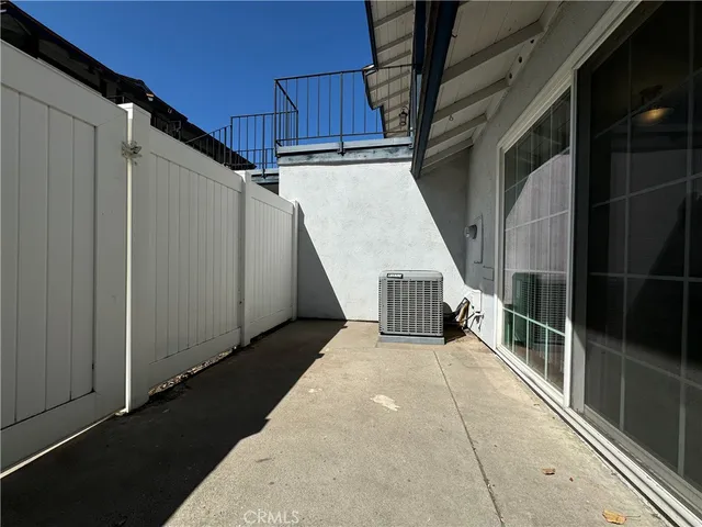 a view of a house with wooden floor and windows