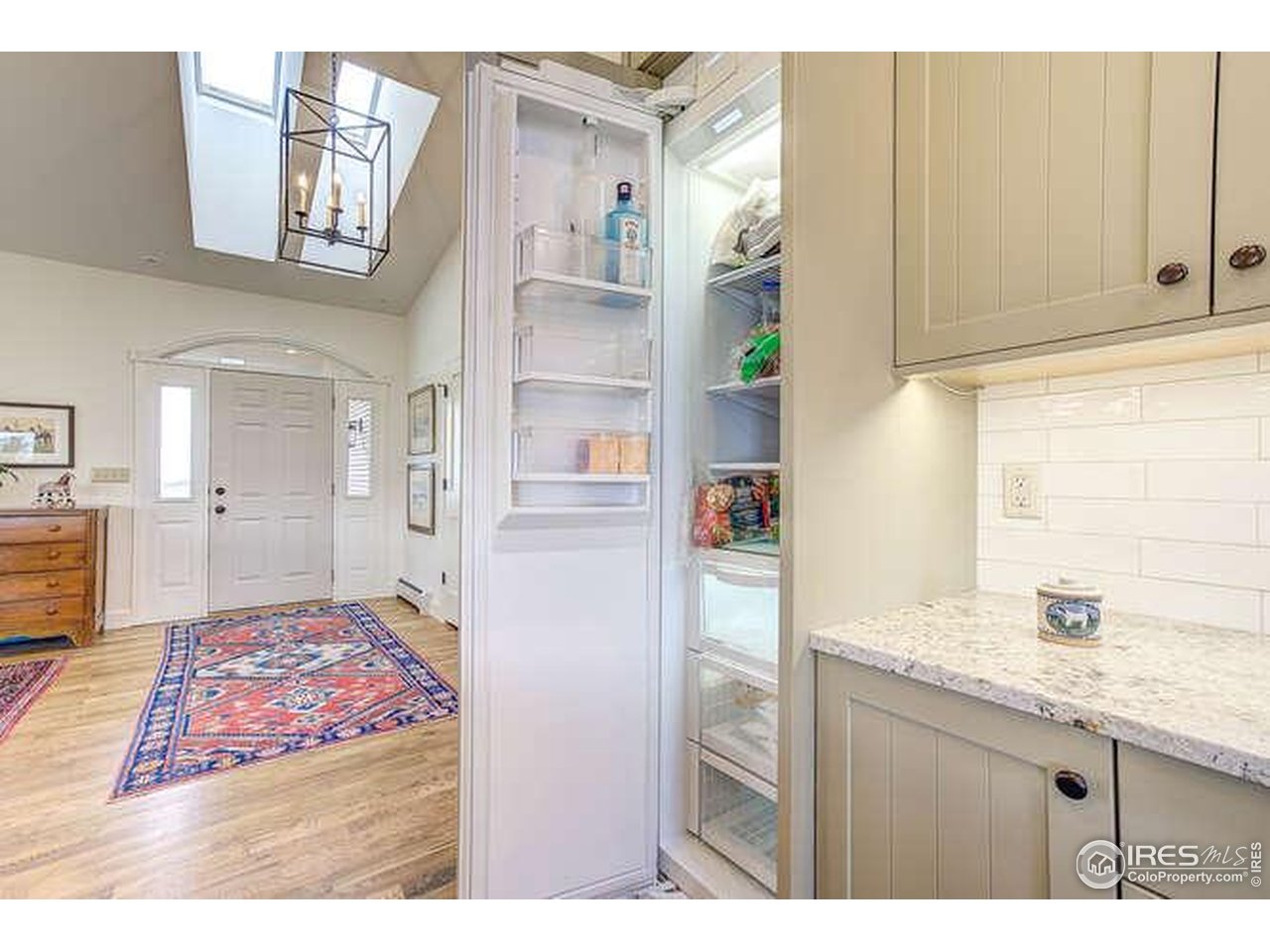 6085 Spring Glade Road Loveland, CO 80538 - Photo 11 of 40 Discreet freezer in kitchen