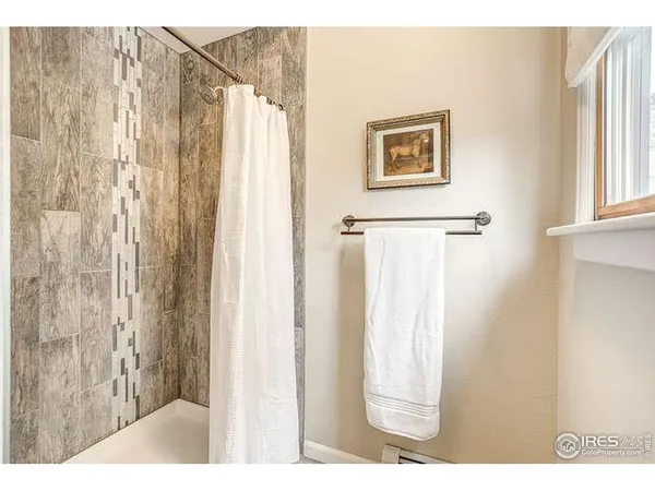 a picture of a bathroom with a shower curtain