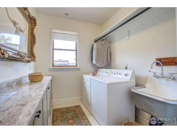 a utility room with two washing machine