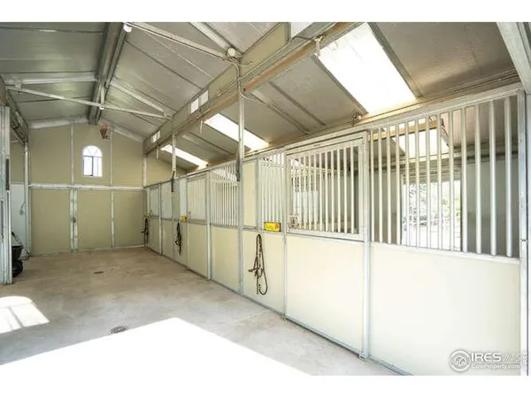 a spacious bathroom with a double vanity sink a mirror and a bathtub