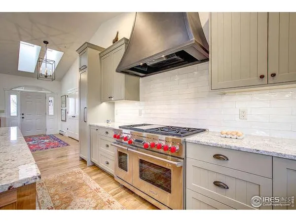 a kitchen with a stove and cabinets