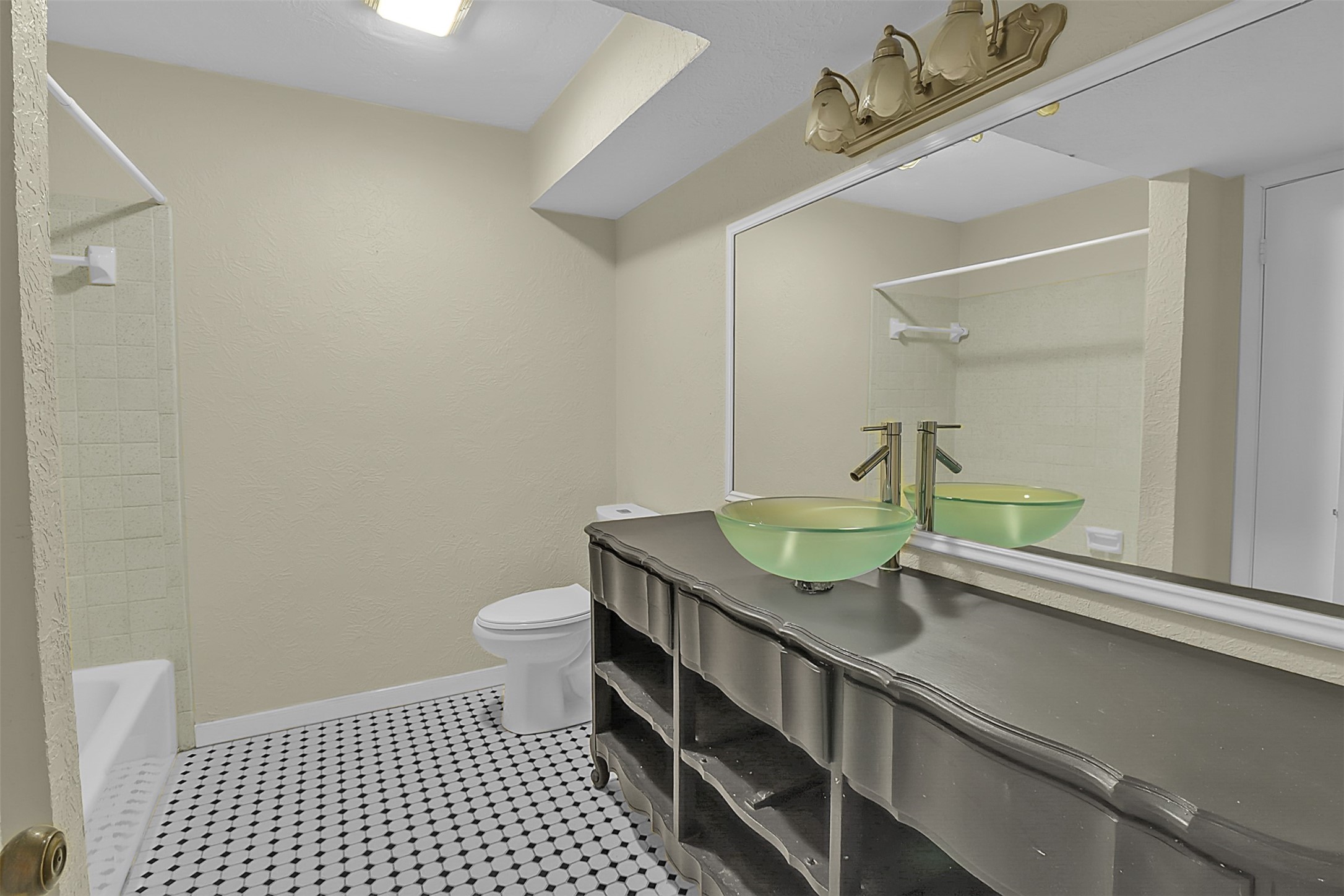 1304 Ward Road, Unit 5 Baytown, TX 77520 - Photo 14 of 19 a bathroom with a sink a toilet and mirror