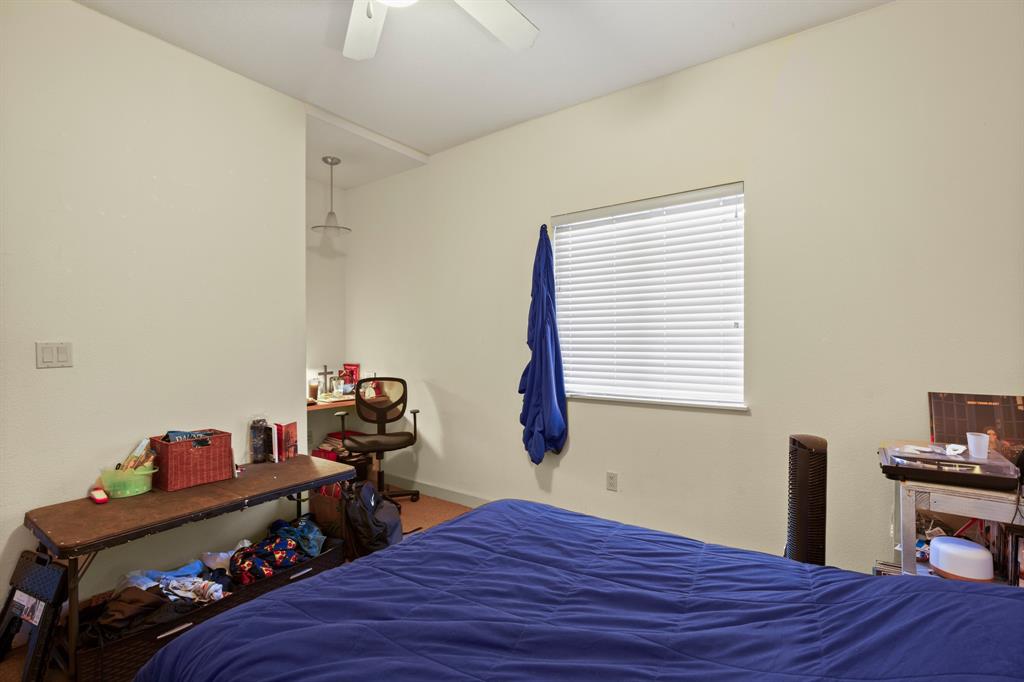 711 West 26th Street, Unit 700 Austin, TX 78705 - Photo 11 of 19 a bed room with a bed and a window
