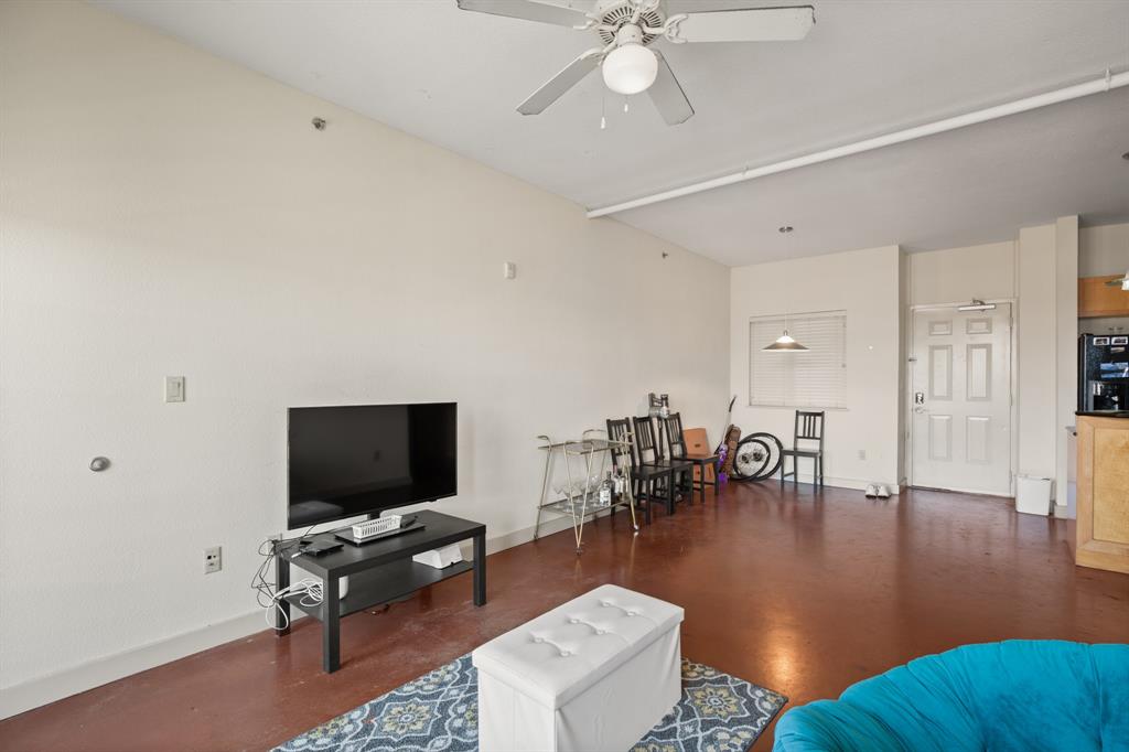 711 West 26th Street, Unit 700 Austin, TX 78705 - Photo 13 of 19 a living room with furniture and a flat screen tv
