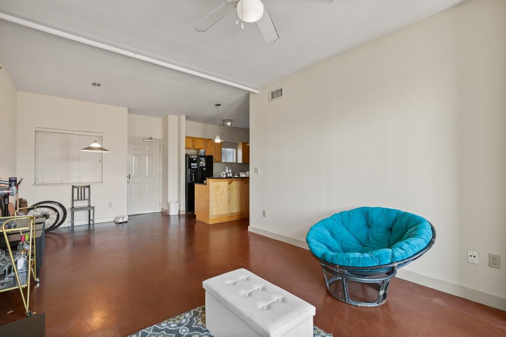711 West 26th Street, Unit 700 Austin, TX 78705 - Photo 14 of 19 a living room with furniture and a table
