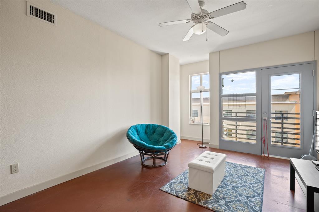 711 West 26th Street, Unit 700 Austin, TX 78705 - Photo 15 of 19 a living room with furniture and a large window
