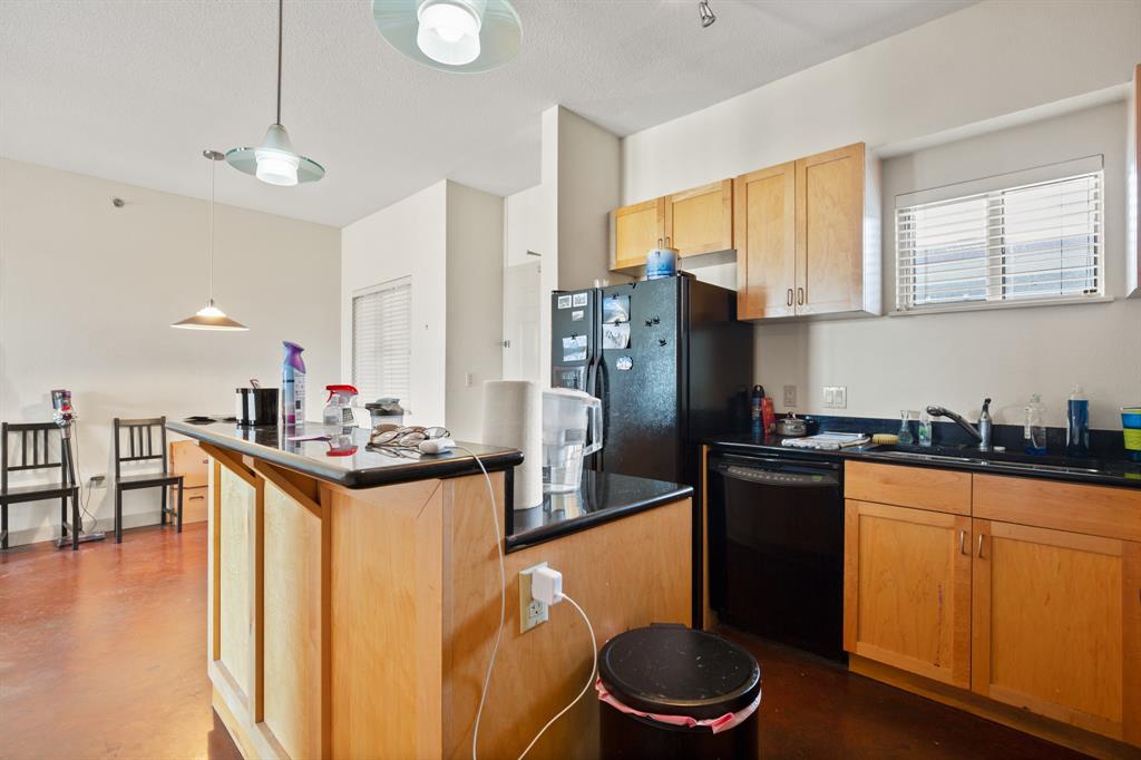 711 West 26th Street, Unit 700 Austin, TX 78705 - Photo 5 of 19 a kitchen with stainless steel appliances granite countertop a sink a stove and refrigerator