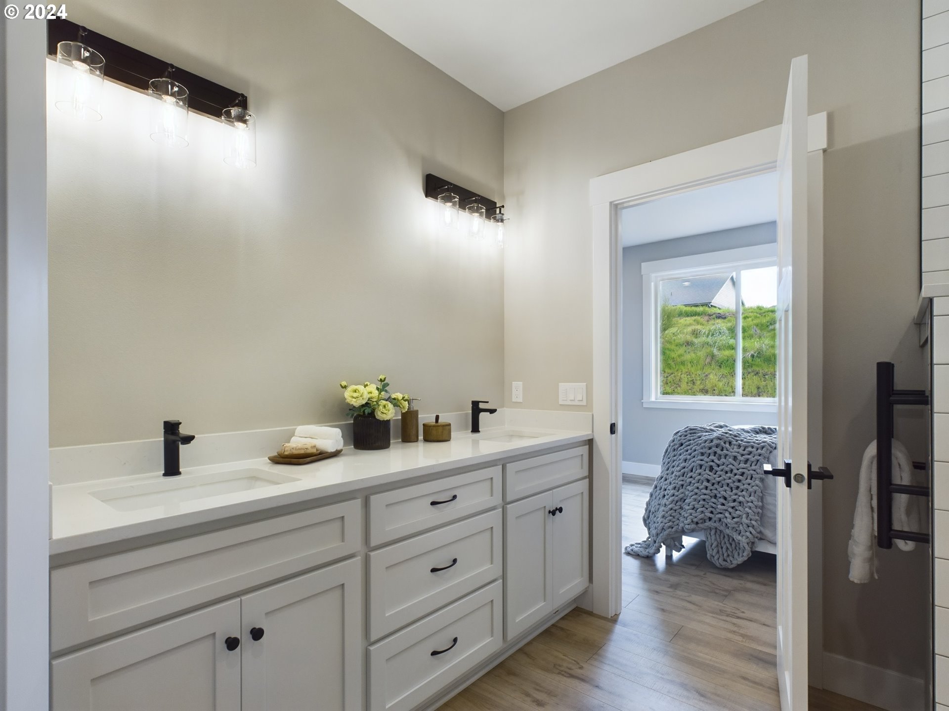 35655 Bella Rdg Loop Astoria, OR 97103 - Photo 23 of 34 a en suite bathroom with 2 sink toilet and a mirror