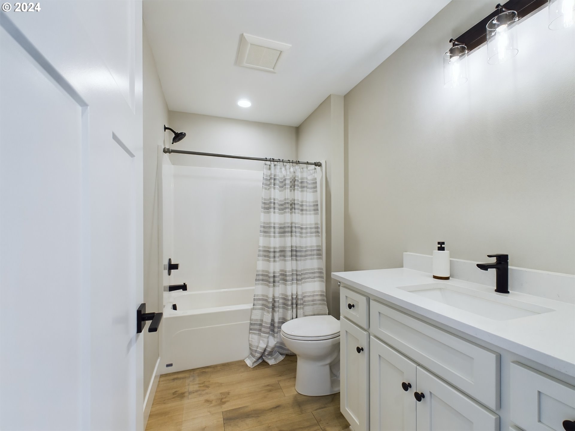 35655 Bella Rdg Loop Astoria, OR 97103 - Photo 29 of 34 a bathroom with a sink toilet vanity and shower