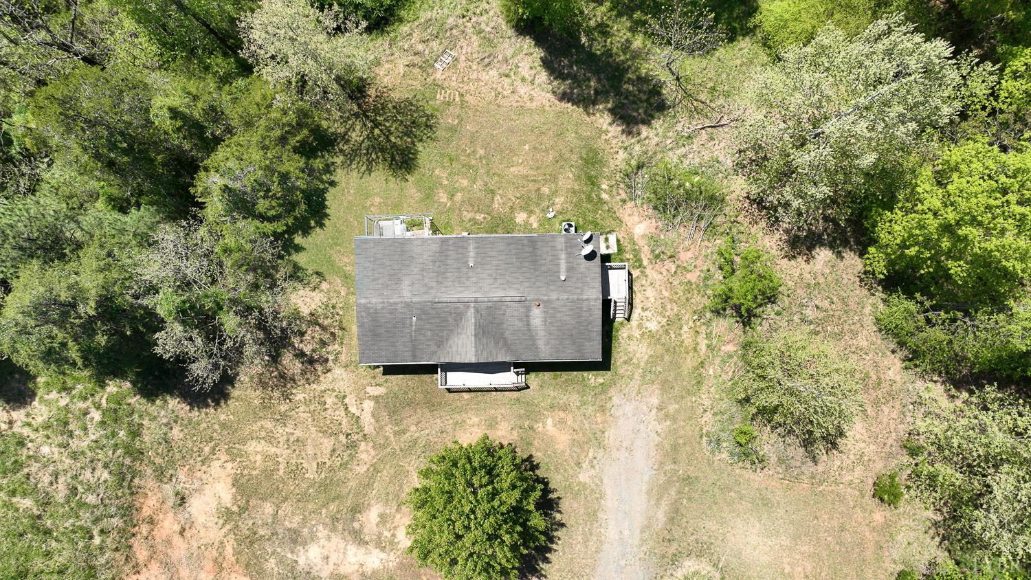 102 Slow Water Court Sandy Level, VA 24161 - Photo 54 of 66 an aerial view of a house with yard and trees all around
