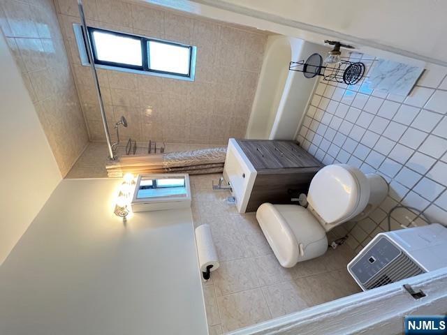 303 Hamilton Place, Unit D4 Hackensack, NJ 07601 - Photo 4 of 9 a bathroom with a sink a toilet a mirror and shower