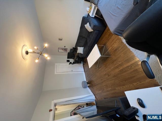 303 Hamilton Place, Unit D4 Hackensack, NJ 07601 - Photo 9 of 9 a living room with furniture and a lamp