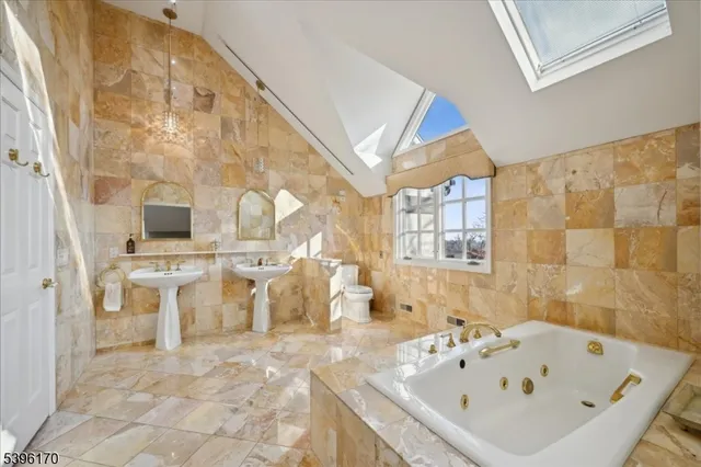 a bathroom with a bathtub and a sink