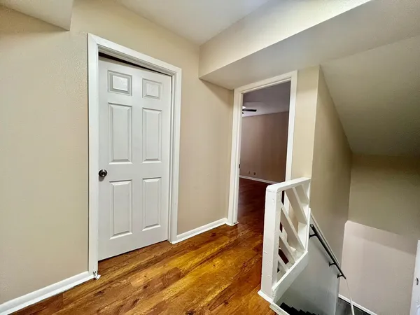 a view of an entryway with wooden floor