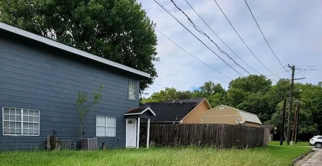a house view with a garden space