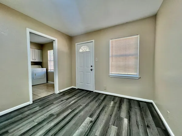 a view of wooden floor in an empty room