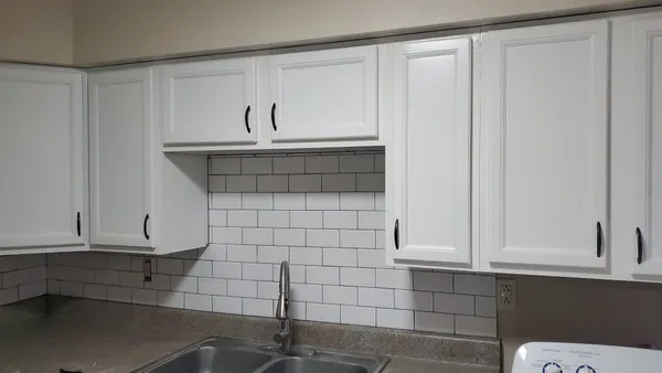 a bathroom with a sink and cabinets