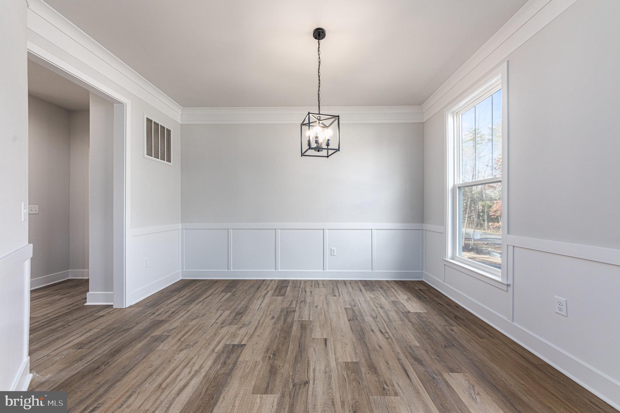 149 Norman Road Stafford, VA 22554 - Photo 12 of 57 a view of empty room with wooden floor and fan