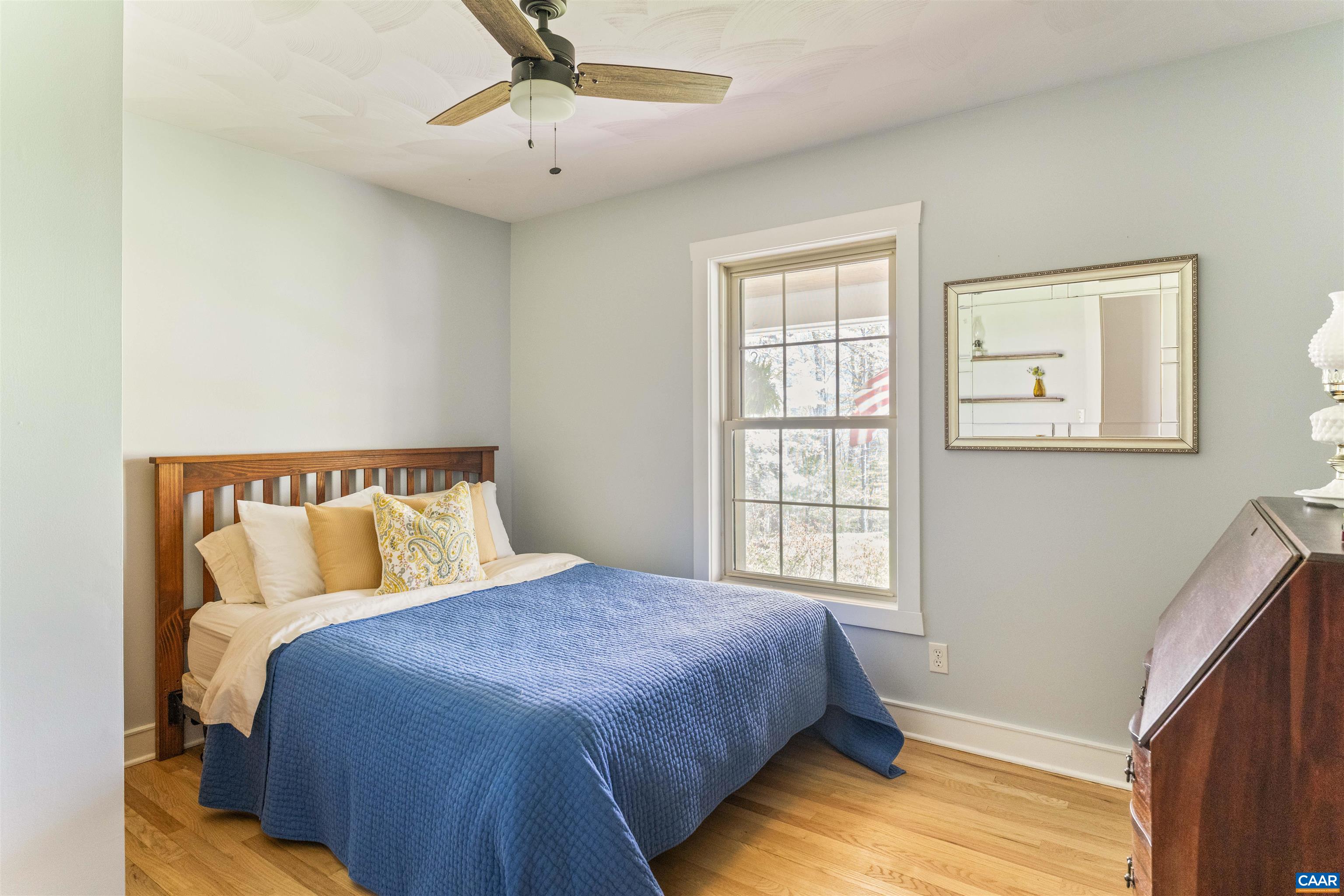 5138 Free Union Road Free Union, VA 22940 - Photo 21 of 55 a bed sitting in a bedroom next to a window