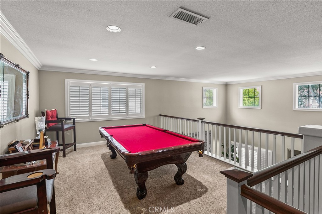 26266 Beecher Lane Stevenson Ranch, CA 91381 - Photo 13 of 25 a living room with furniture pool table and windows