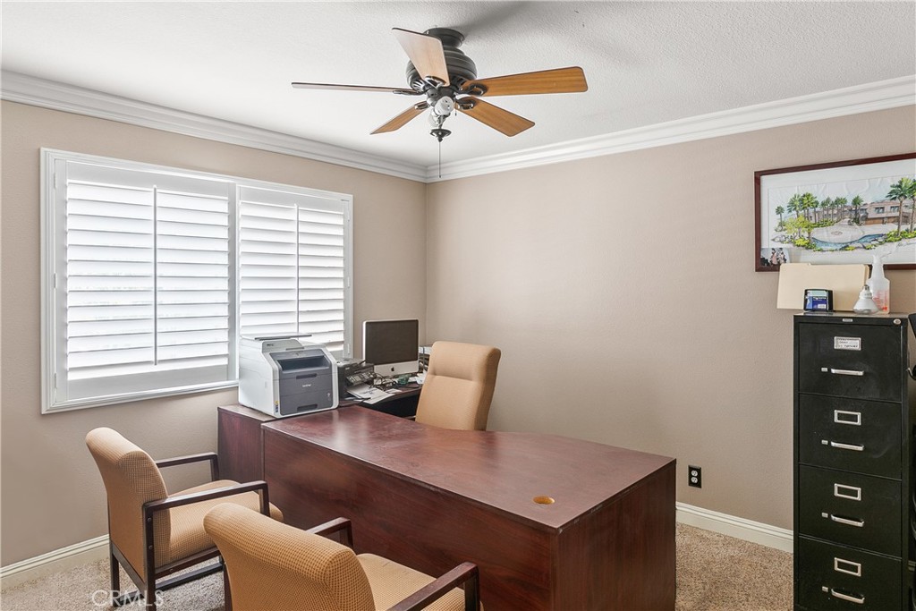 26266 Beecher Lane Stevenson Ranch, CA 91381 - Photo 17 of 25 a view of a workspace with furniture and a window