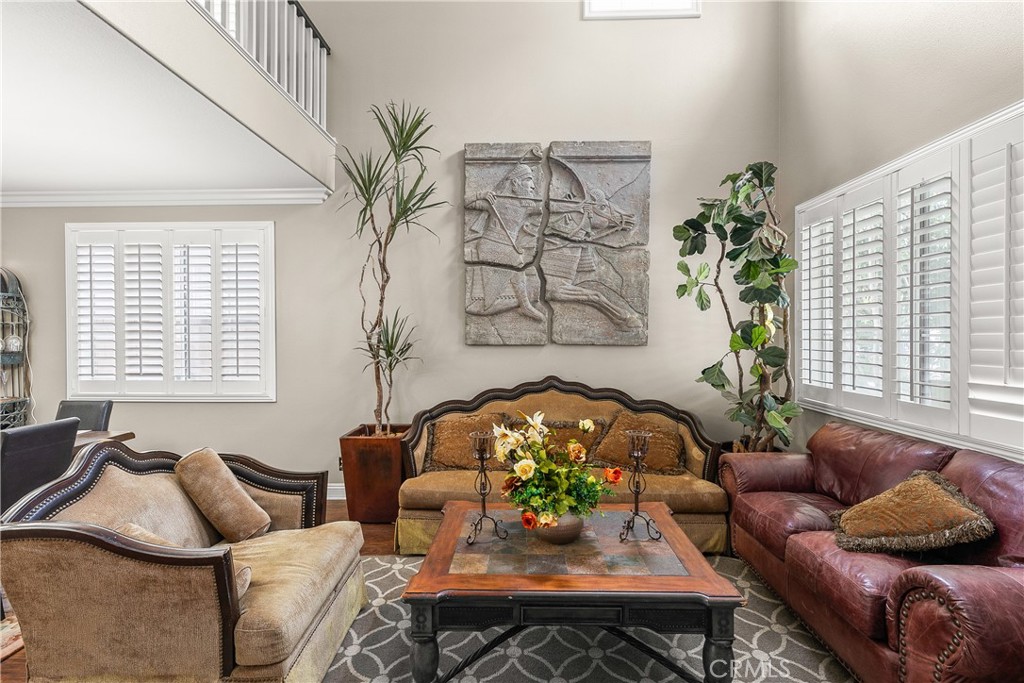26266 Beecher Lane Stevenson Ranch, CA 91381 - Photo 5 of 25 a living room with furniture and a potted plant