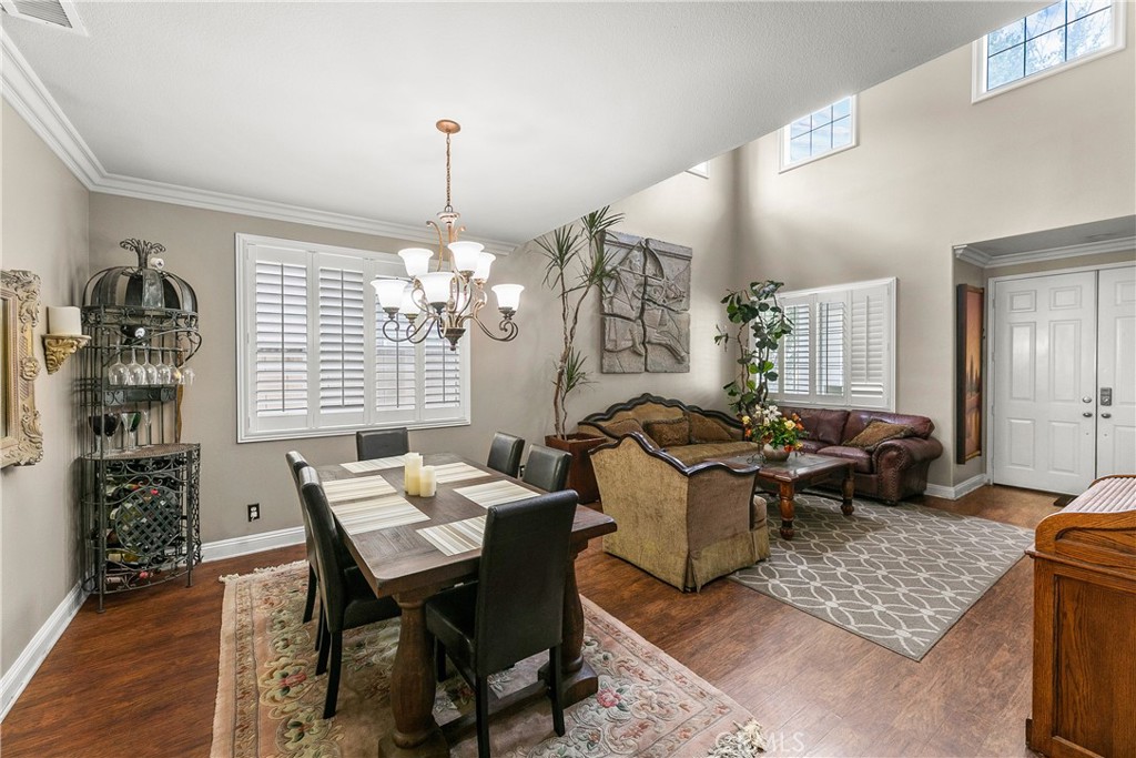 26266 Beecher Lane Stevenson Ranch, CA 91381 - Photo 6 of 25 a living room with furniture and a chandelier