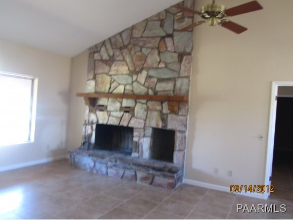 912 Forest Hylands Road, Unit 1 Prescott, AZ 86303 - Photo 3 of 10 a living room with furniture and a fireplace
