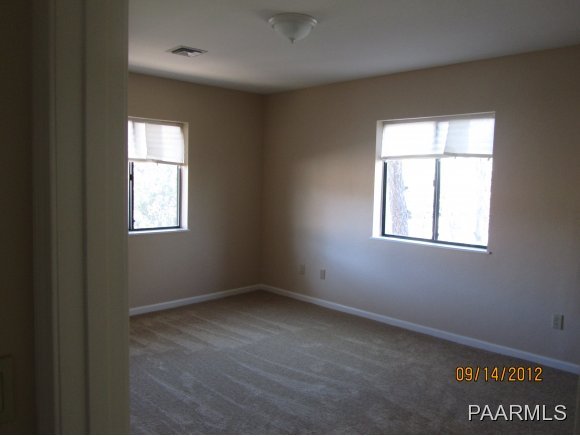 912 Forest Hylands Road, Unit 1 Prescott, AZ 86303 - Photo 4 of 10 an empty room with windows