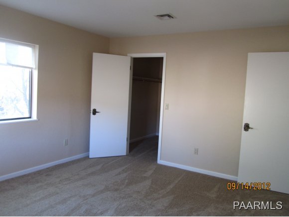 912 Forest Hylands Road, Unit 1 Prescott, AZ 86303 - Photo 7 of 10 an empty room with windows