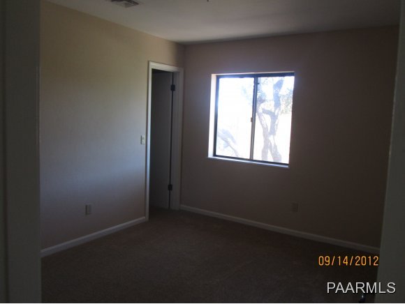 912 Forest Hylands Road, Unit 1 Prescott, AZ 86303 - Photo 8 of 10 an empty room with a window