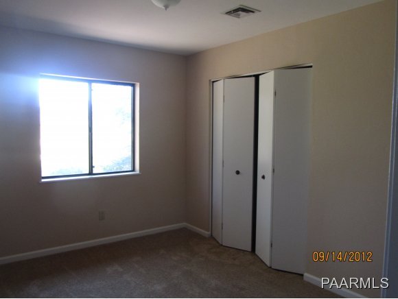 912 Forest Hylands Road, Unit 1 Prescott, AZ 86303 - Photo 9 of 10 an empty room with a window