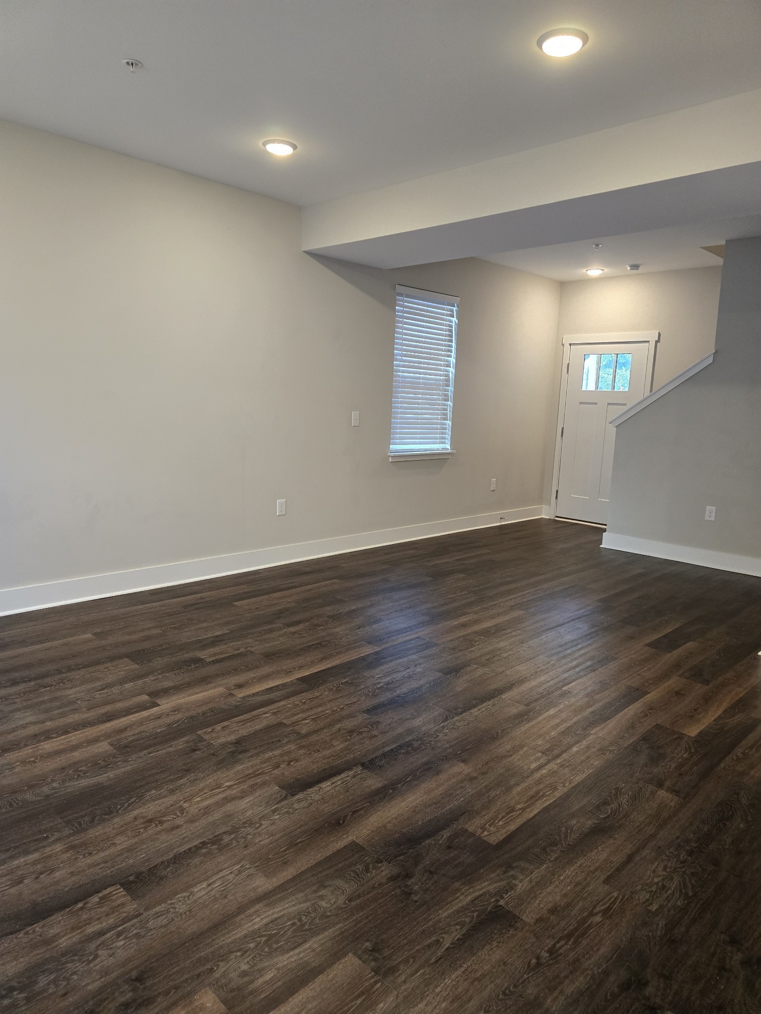 6008 Hillside Lane Spring Hill, TN 37174 - Photo 14 of 32 an empty room with wooden floor and windows