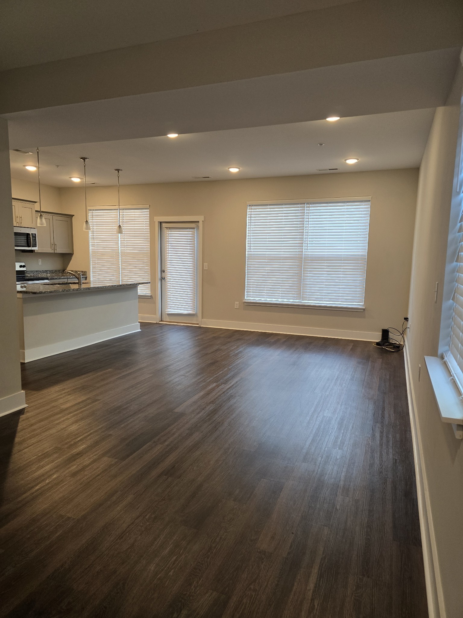 6008 Hillside Lane Spring Hill, TN 37174 - Photo 18 of 32 an empty room with wooden floor and windows