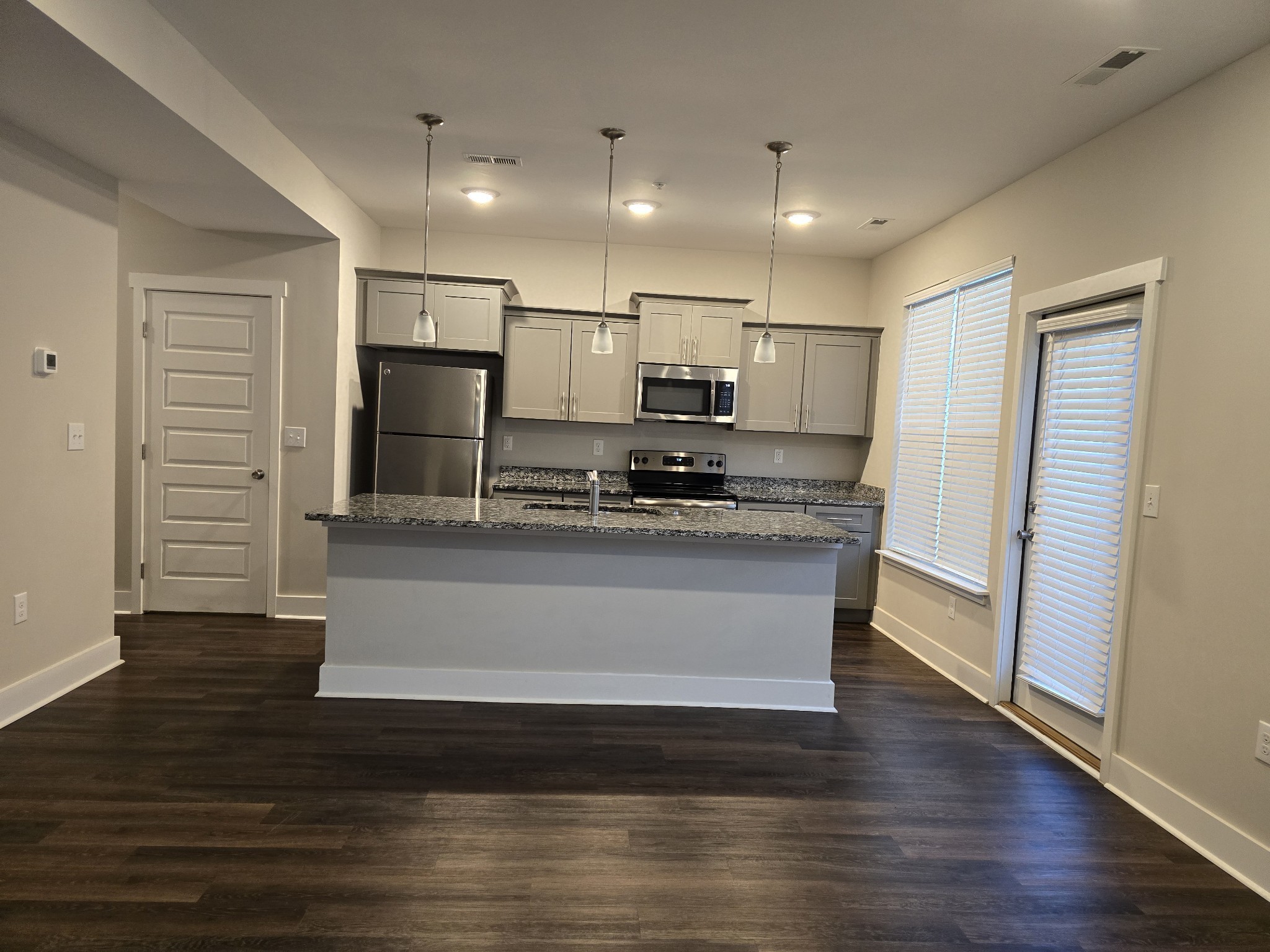 6008 Hillside Lane Spring Hill, TN 37174 - Photo 7 of 32 a view of kitchen with wooden floor and electronic appliances