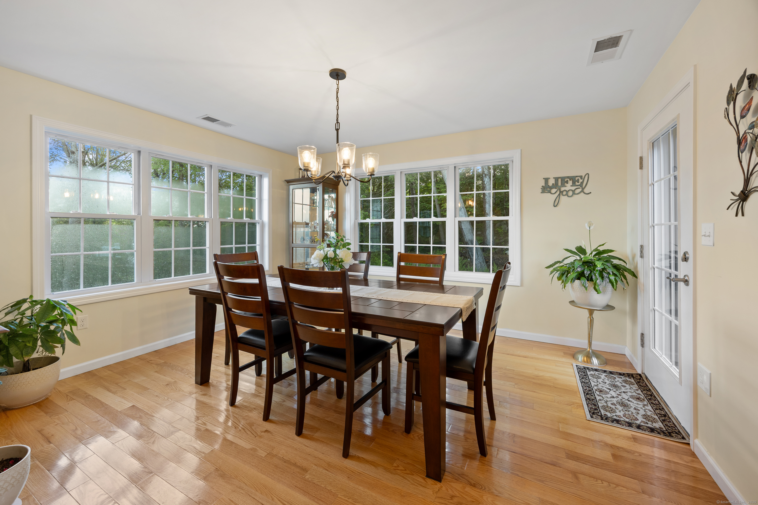 29 Hannah Way Harwinton, CT 06791 - Photo 14 of 34 a view of a dining room with furniture window and wooden floor