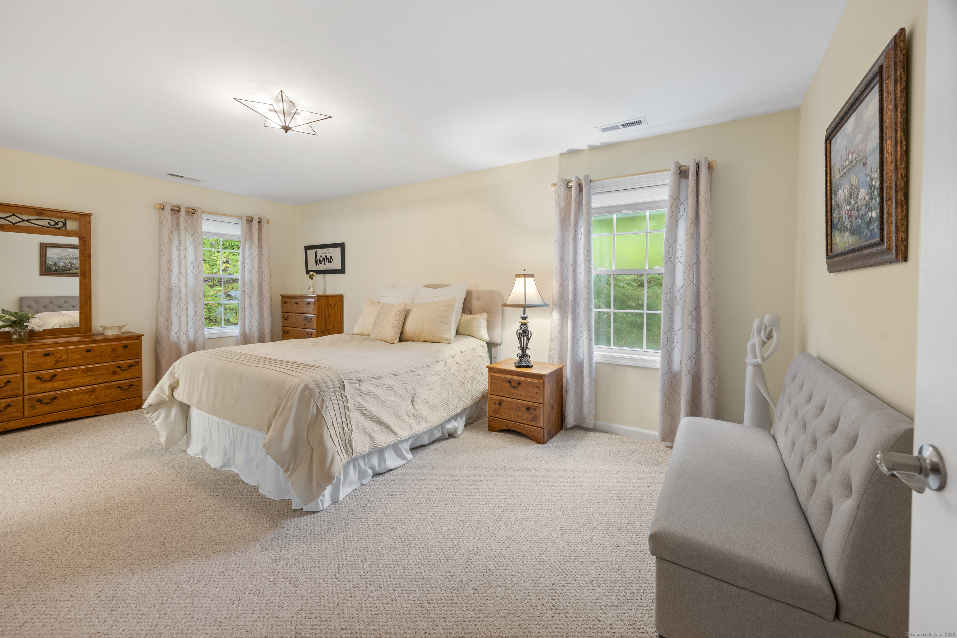 29 Hannah Way Harwinton, CT 06791 - Photo 16 of 34 a bed room with a bed and a couch