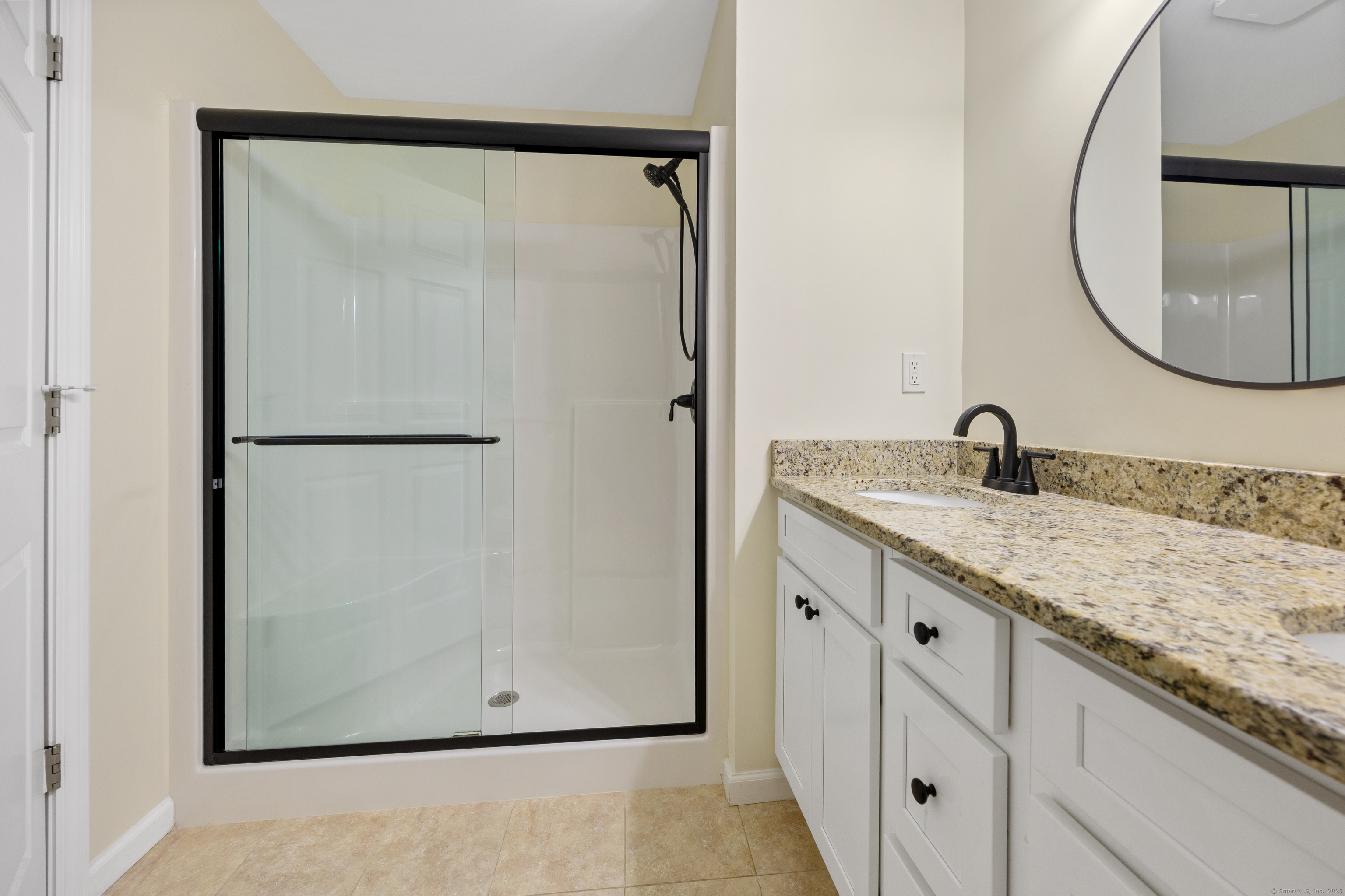 29 Hannah Way Harwinton, CT 06791 - Photo 20 of 34 a bathroom with a granite countertop sink and a mirror