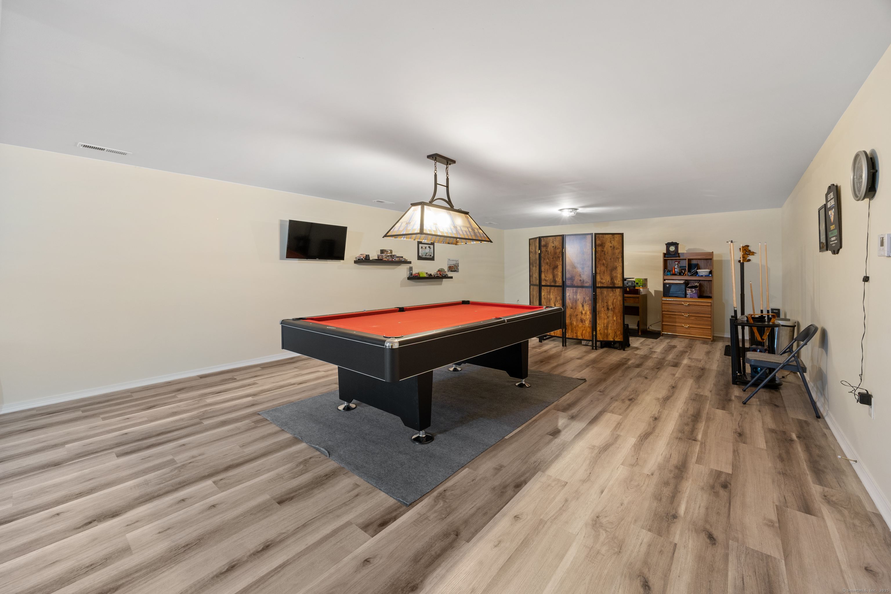 29 Hannah Way Harwinton, CT 06791 - Photo 26 of 34 a living room with furniture a table and wooden floor