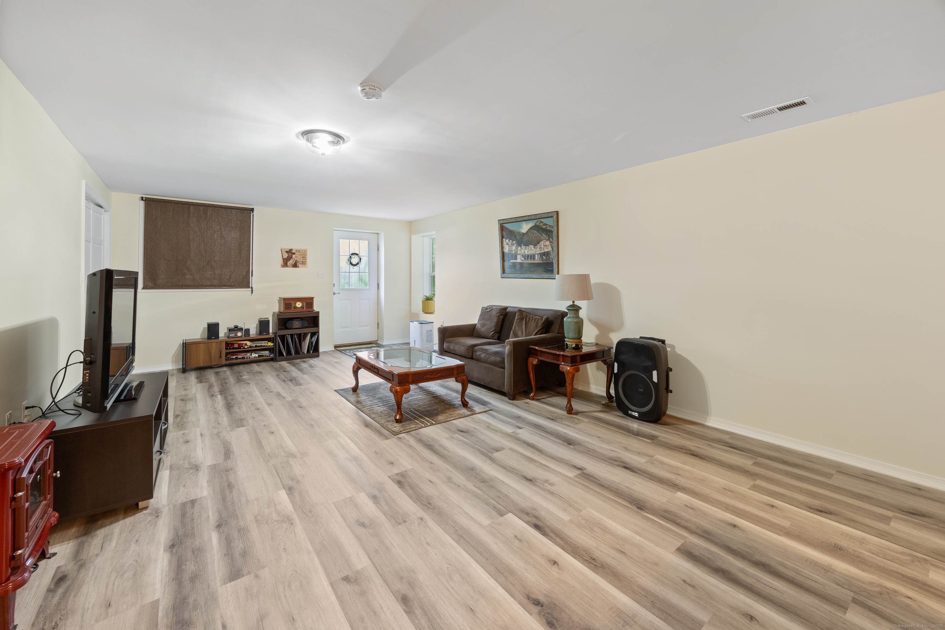 29 Hannah Way Harwinton, CT 06791 - Photo 28 of 34 a living room with furniture and a flat screen tv