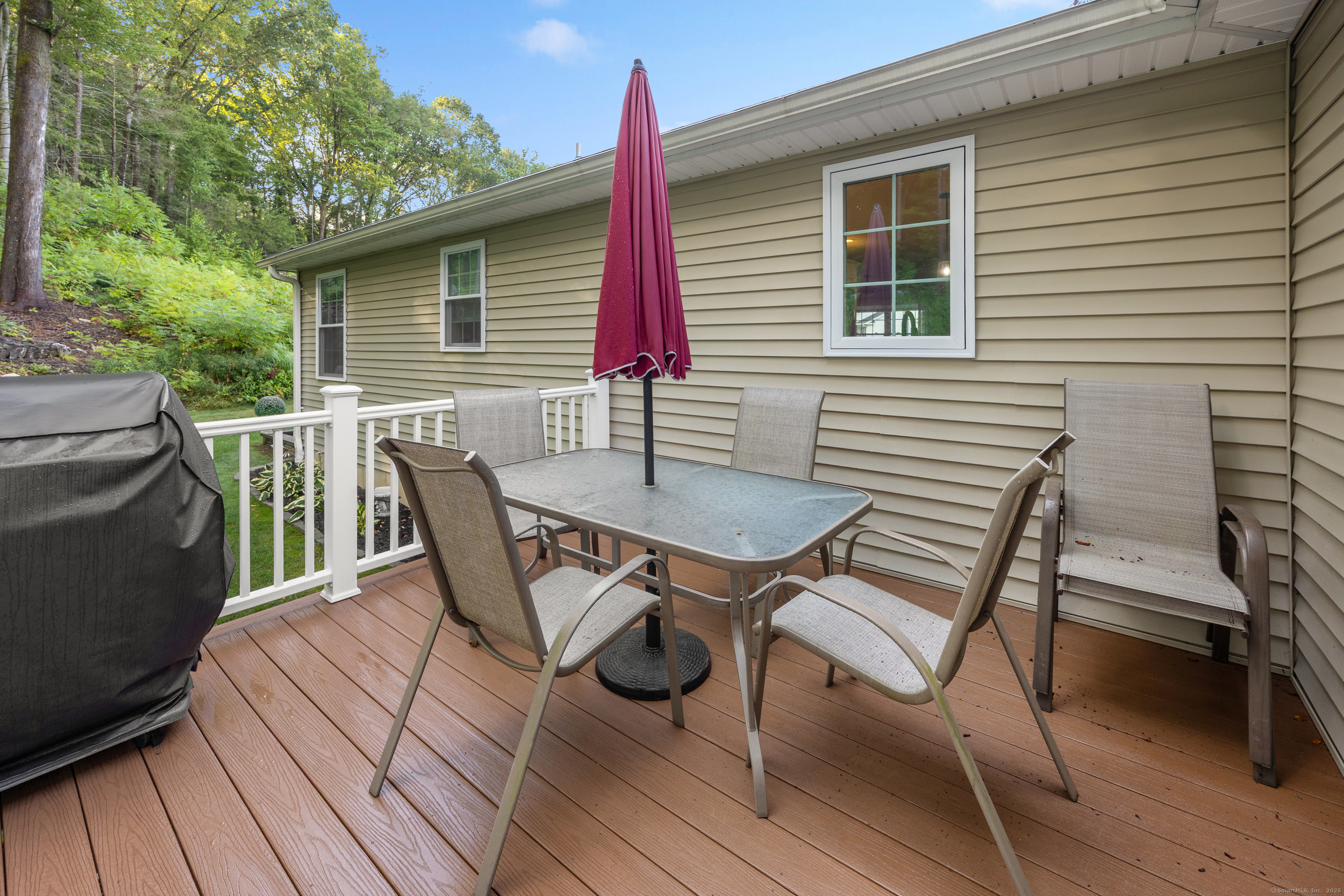 29 Hannah Way Harwinton, CT 06791 - Photo 29 of 34 a roof deck with table and chairs and potted plants
